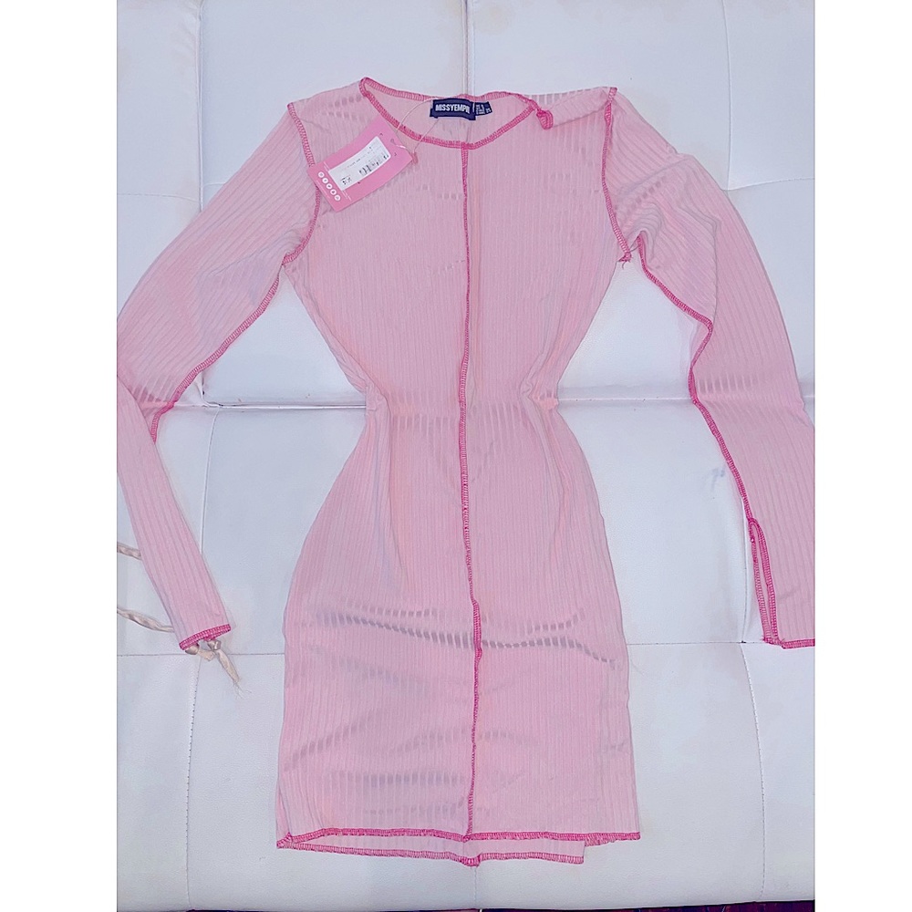 Tried on only. Never worn. With tags. Baby pink.